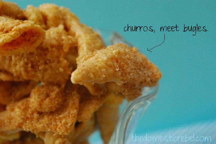 Pieces of churro bugle mix on a blue background with the caption "churros, meet bugles." and an arrow pointing to it